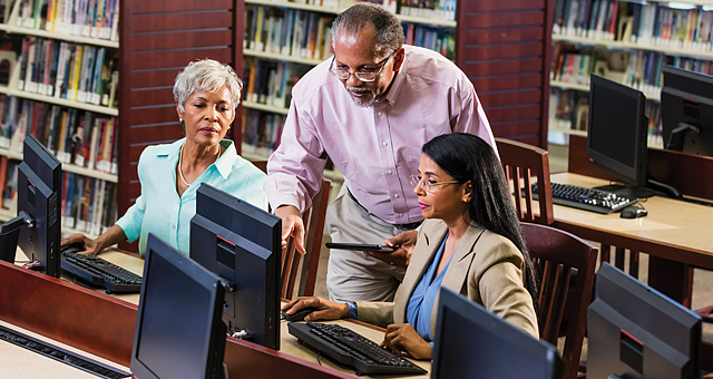 Business librarian helping patrons